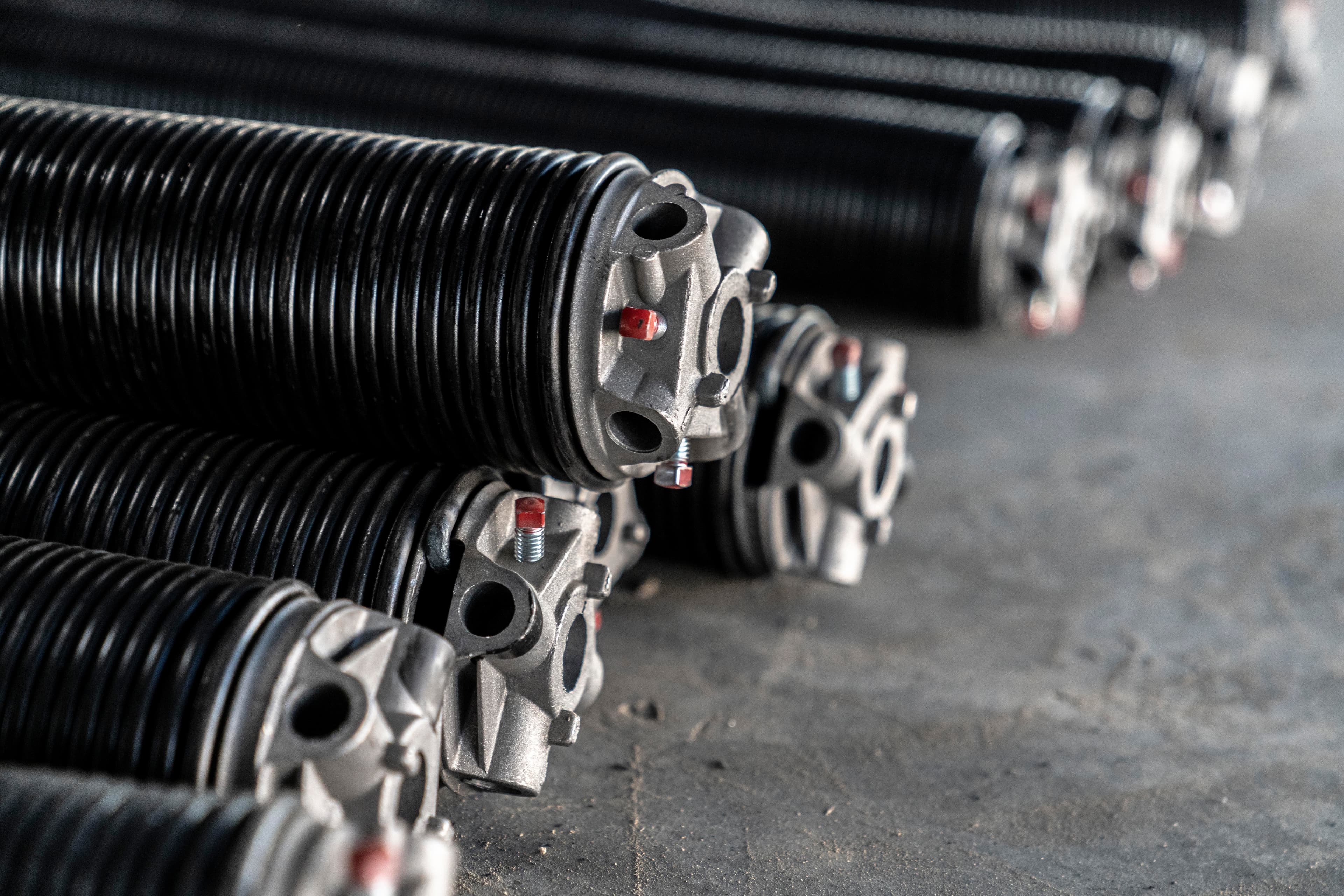 Commercial garage door spring repair technician