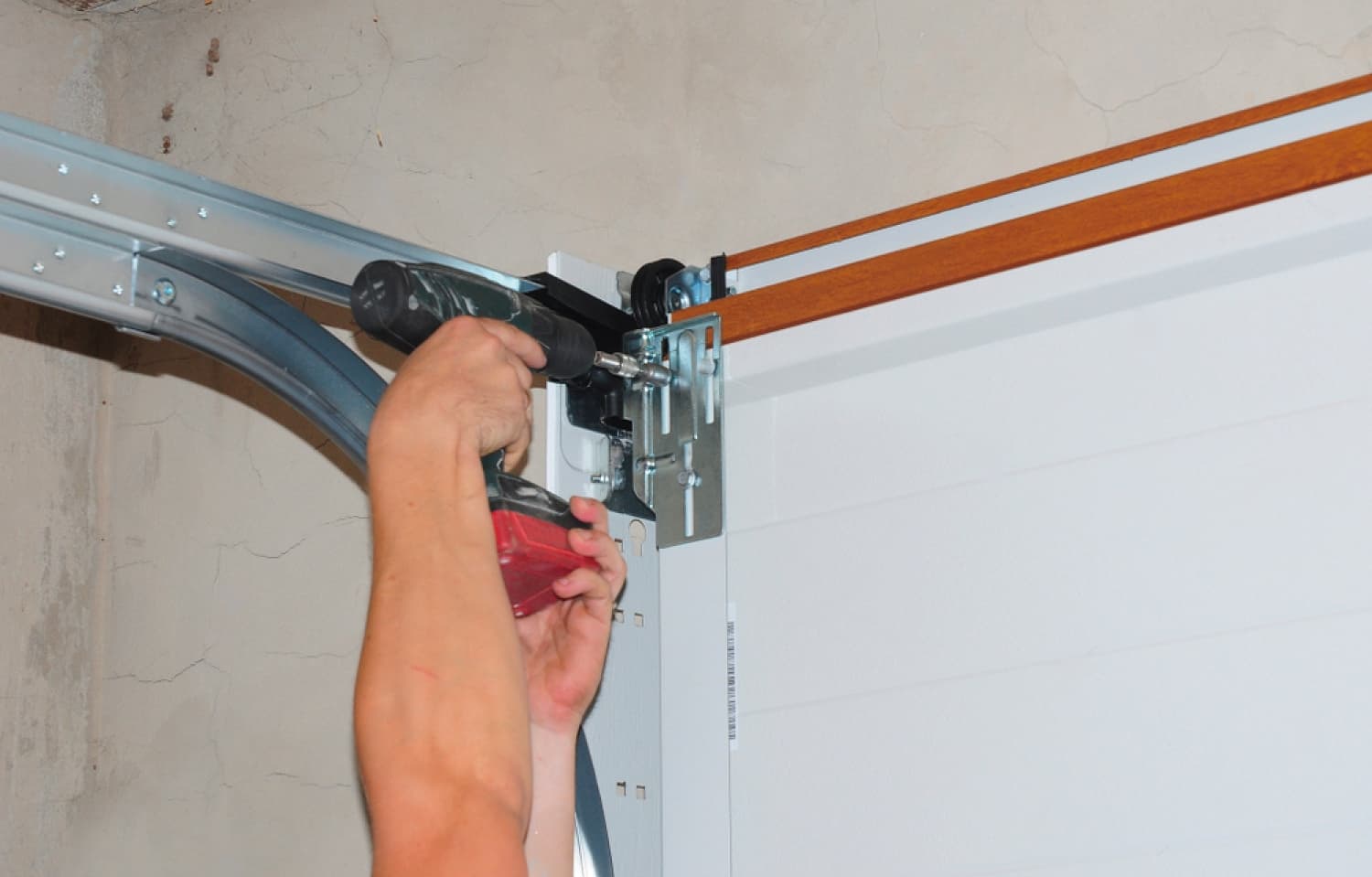 Expert technician repairing a garage door