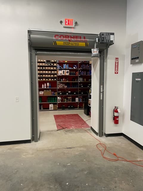 Inspector reviewing a rated overhead door