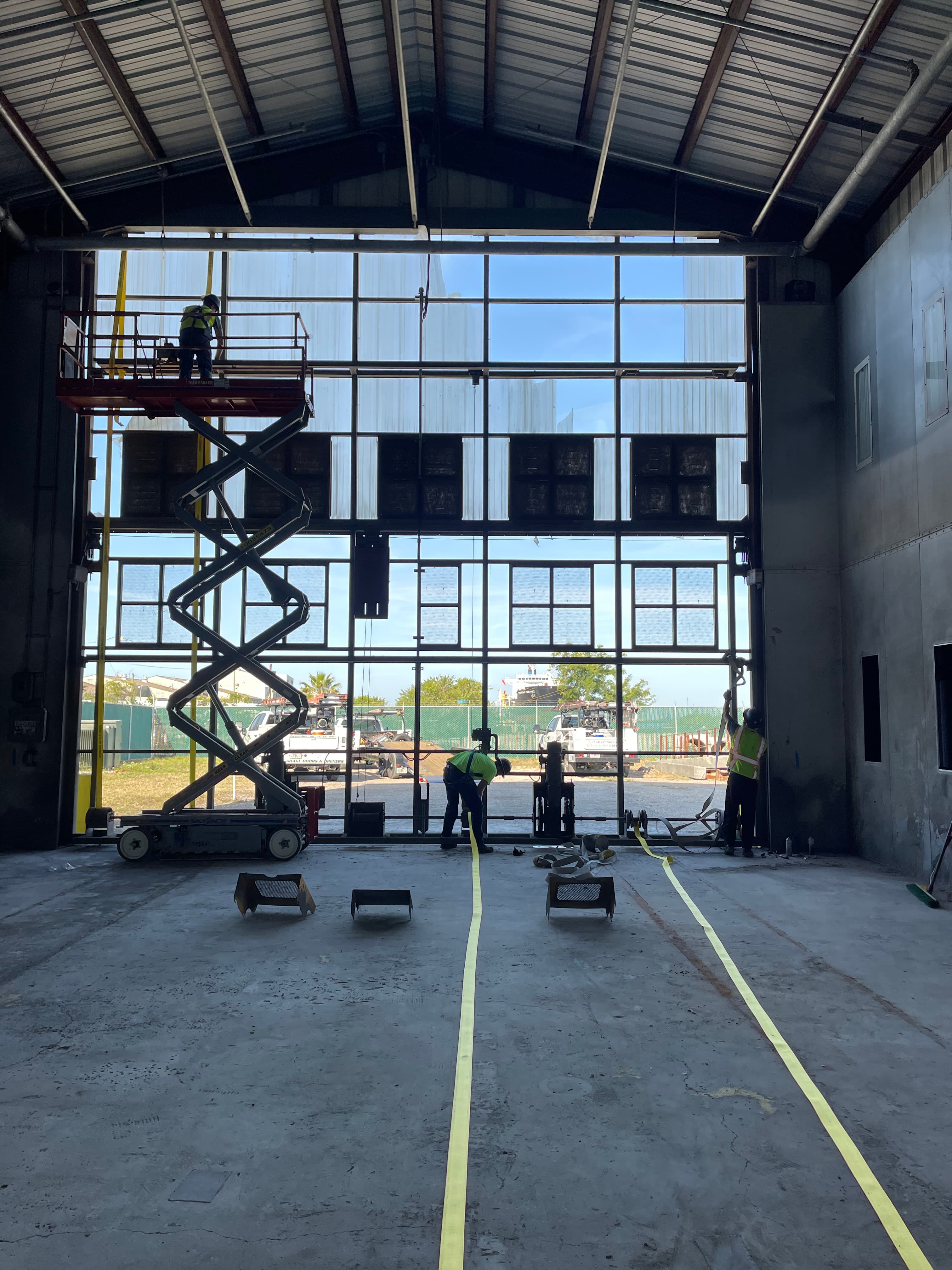 Bifold hangar door opening at a private airstrip